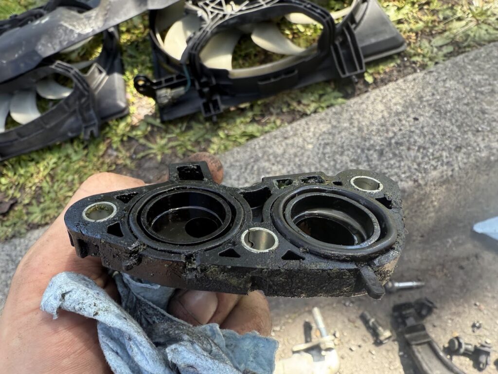 Subaru cooling system component during radiator replacement
