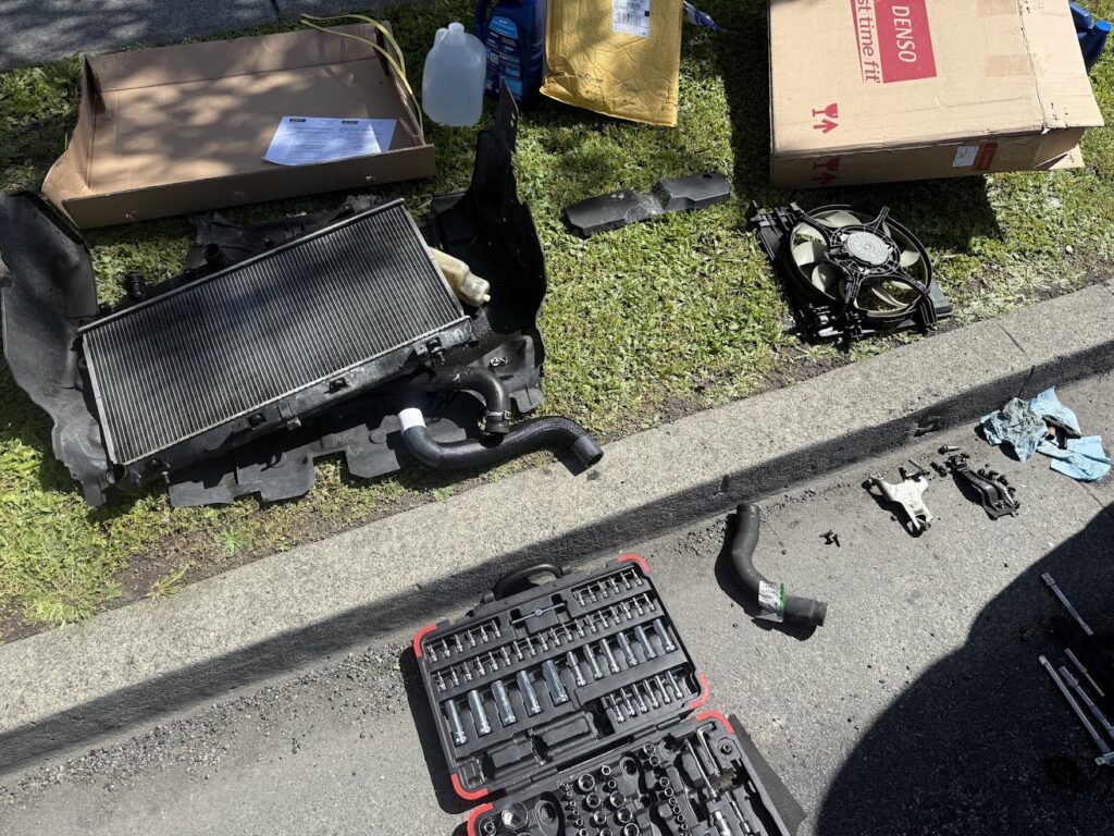 Subaru radiator replacement parts and tools prepared for installation