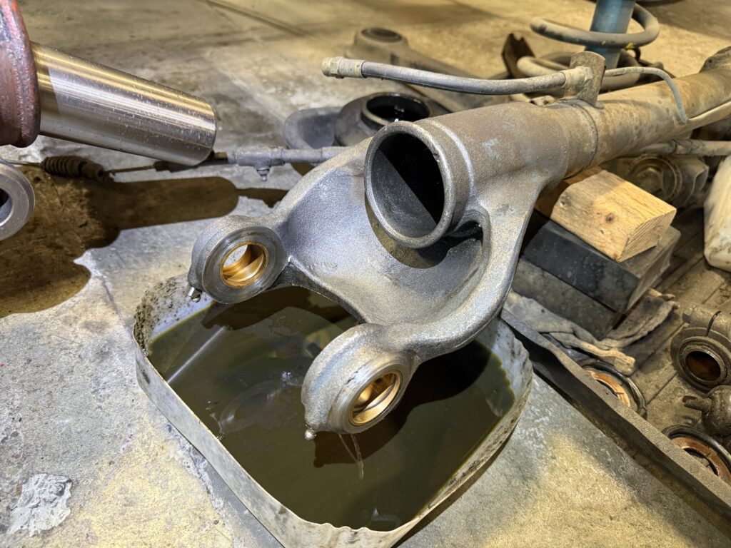 Mercedes SL190 rear axle housing and differential casing draining gear oil during repair