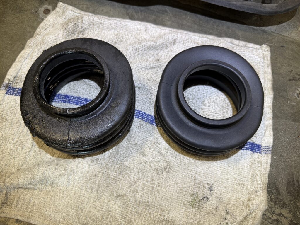 Mercedes SL190 CV boot comparison old vs new showing worn and replaced axle boot